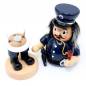 Preview: „Lustige Räuchermannfigur aus Holz in Polizistenuniform mit Pistole und Handschellen – bauchige Form, Rauchöffnung im Mund, ca. 16 cm hoch.“