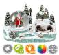Preview: Eine große Schneekugel mit Santa und seinem Schlitten im Inneren und einer kleinen Eisenbahn, die um die Kugel herum