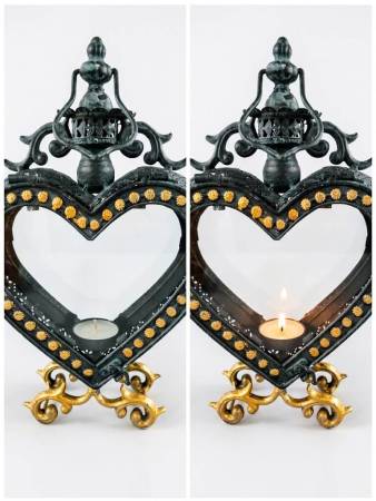 Herz-Laterne in rustikalem Metall mit goldfarbenen Ornamenten, 32cm h, auf einem stumpen Kerzenständer mit Teelicht.
