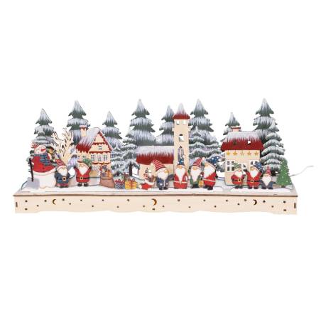 Verschneite Häuser mit Sternen und Tannenbäumen im Hintergrund – liebevoll bemalte Details des LED-Dioramas „Wichtelhausen“.