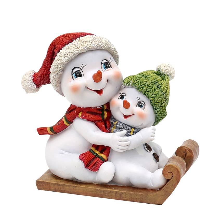 mitti mit kind schneemann auf schlitten schneekinder
