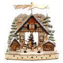 Weihnachtspyramide mit verschneitem Haus und Winterfiguren